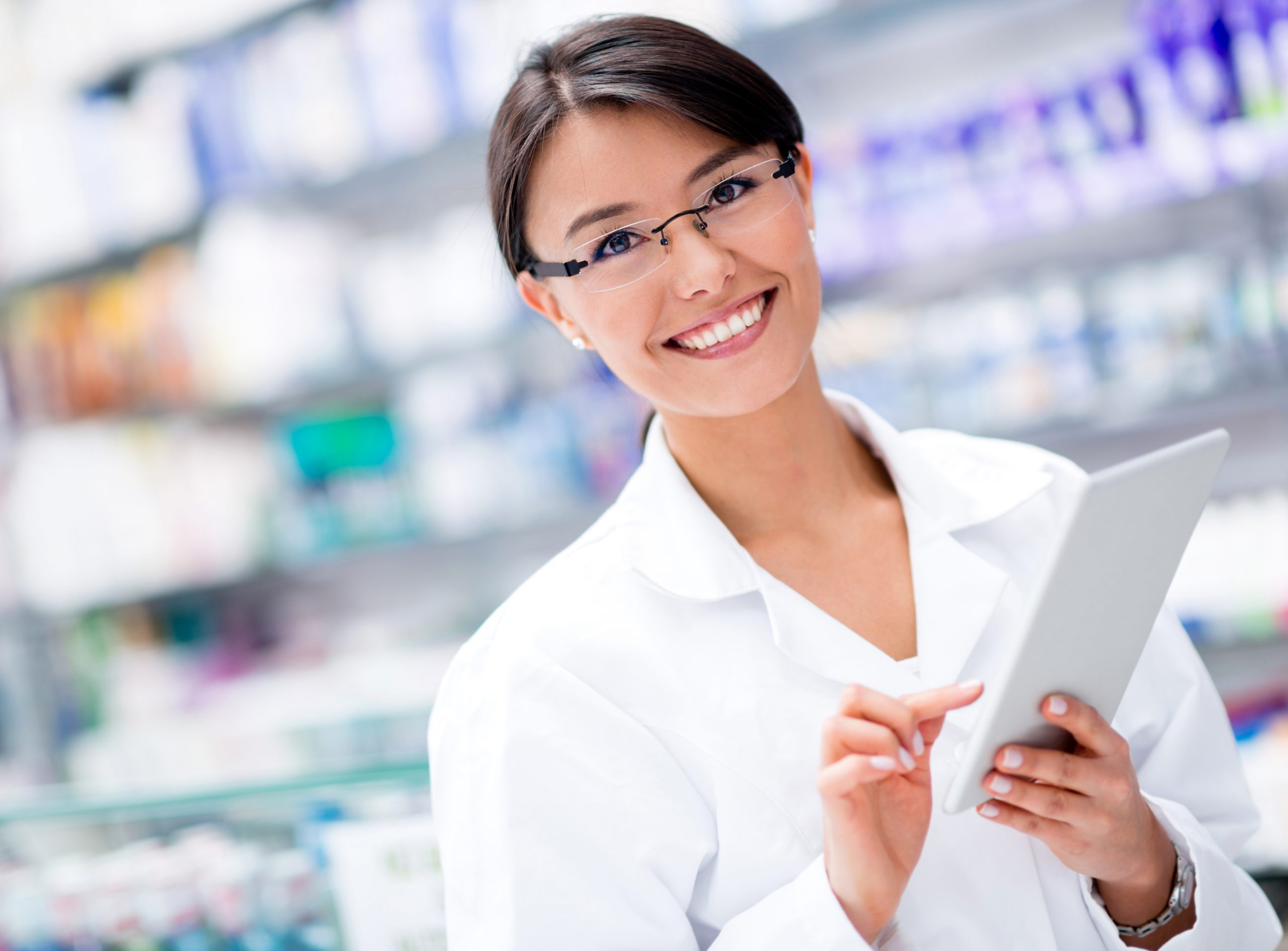 Woman at the drugstore with a tablet